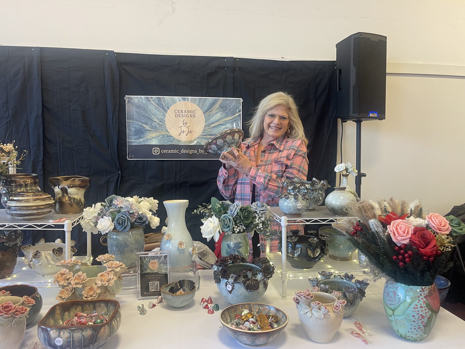 JoJo (Joanne Levin) with her ceramics at a show