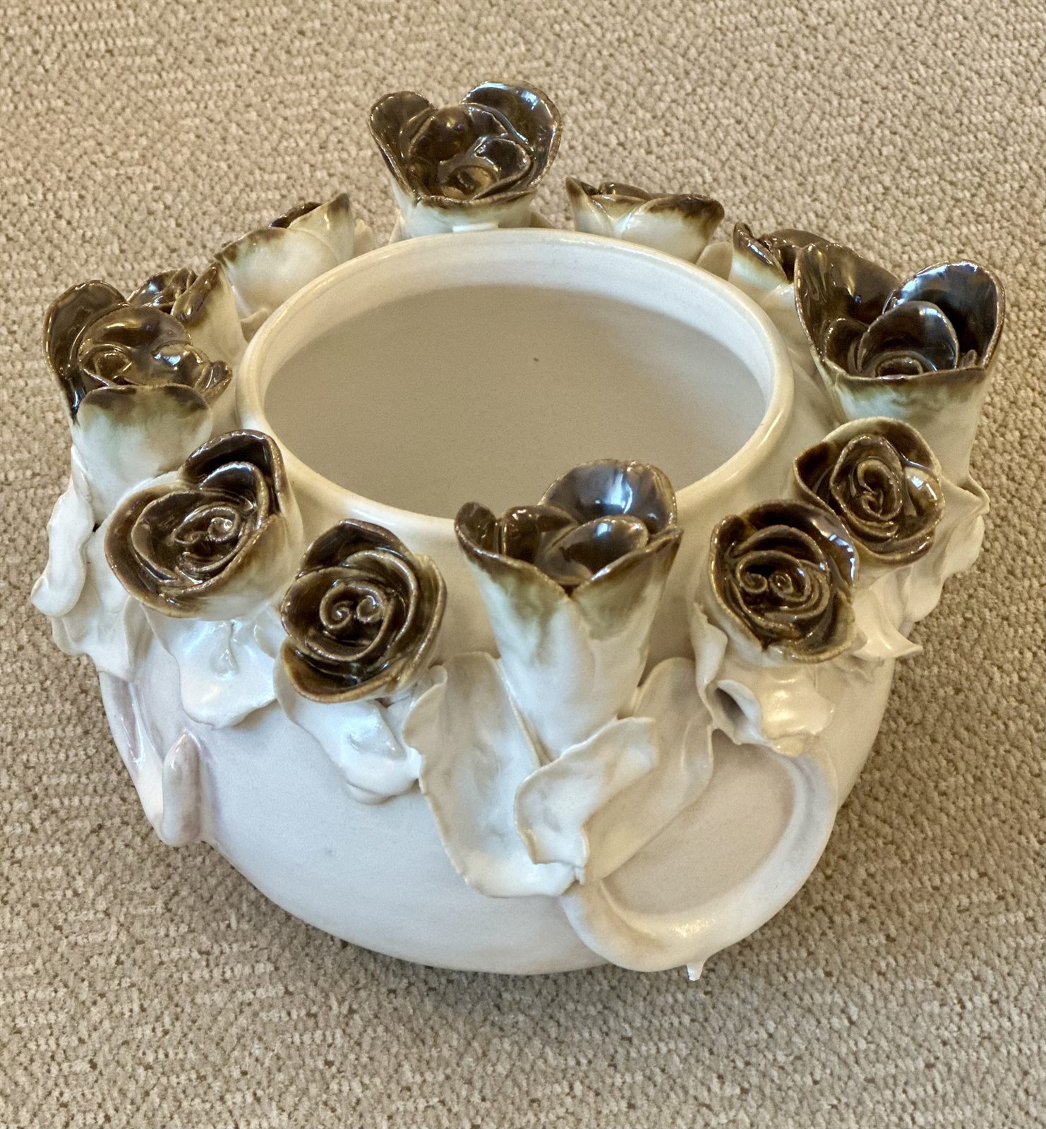 Ivory pot with bronze-tipped roses
